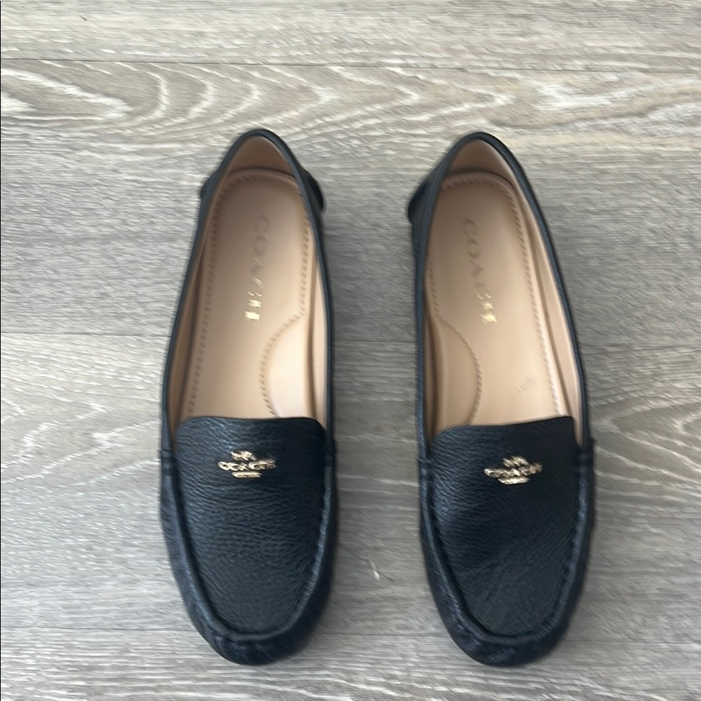 Coach Black Leather Slip-On Loafers with Gold Emblem